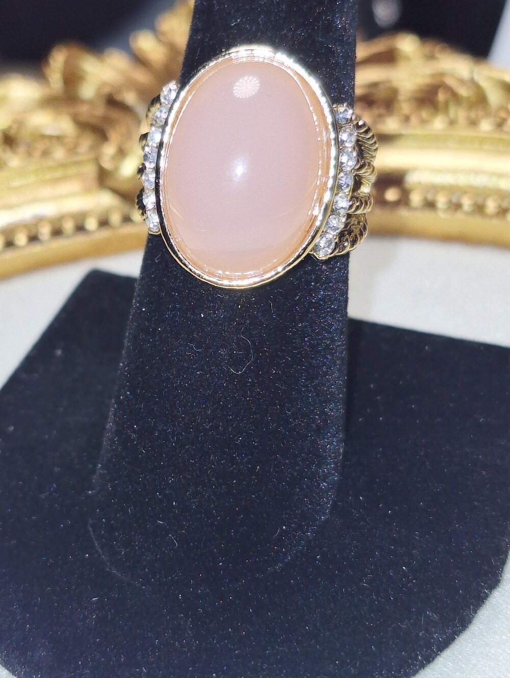 Gold-tone Ring with Pink Cabochon and Accent Stones